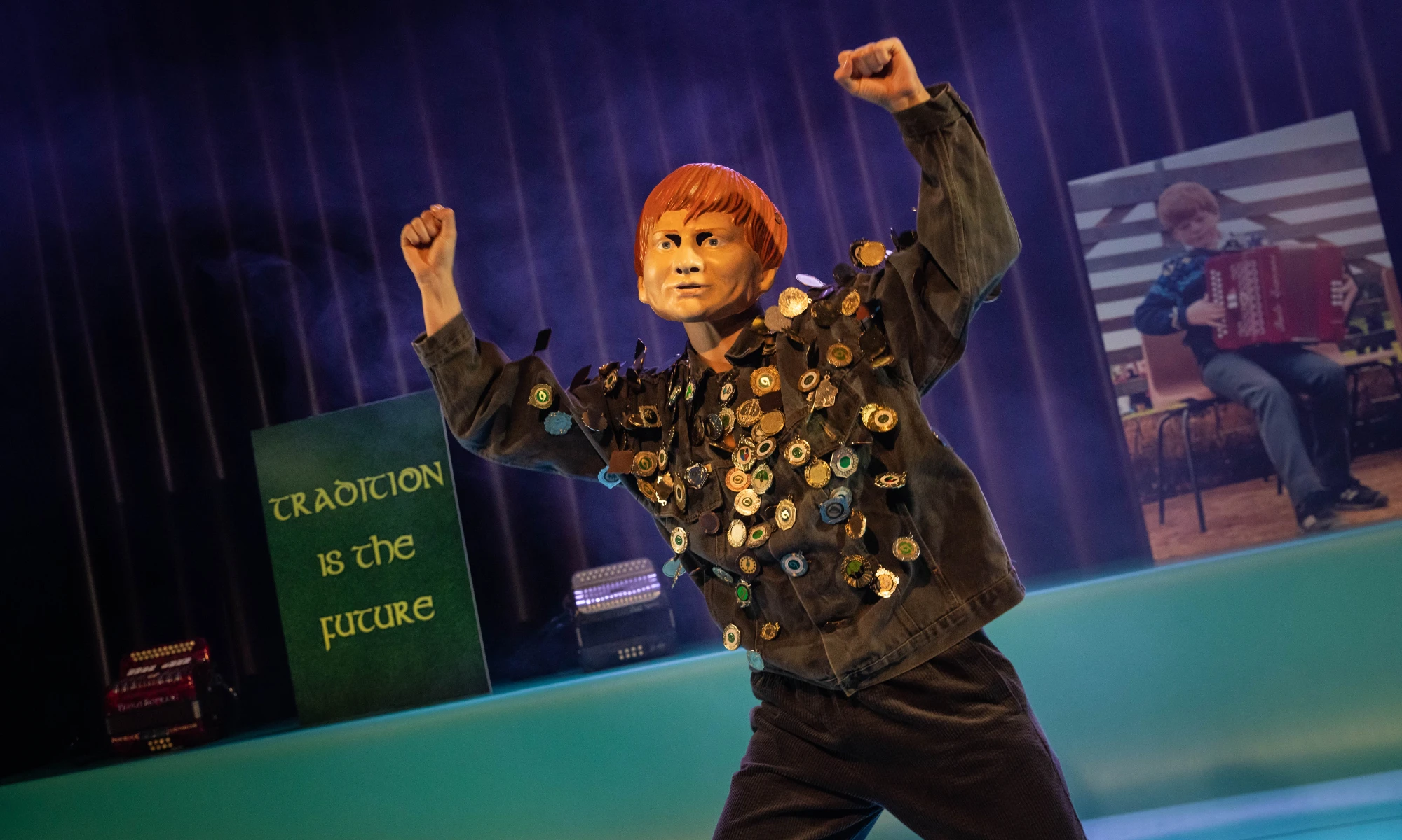 Photo of masked actor from Bellow dancing on stage