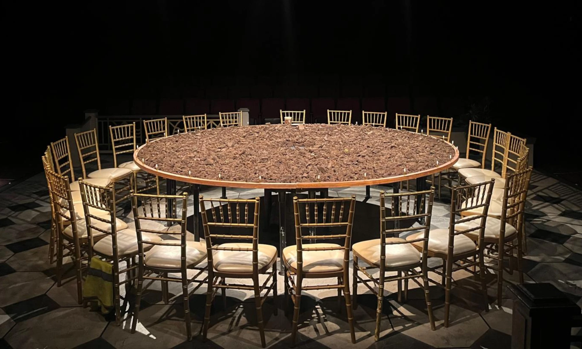 Photo of round table with seats around it
