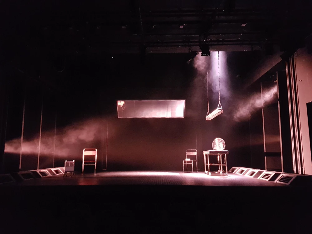 Set design with window, swing chairs and smoke.