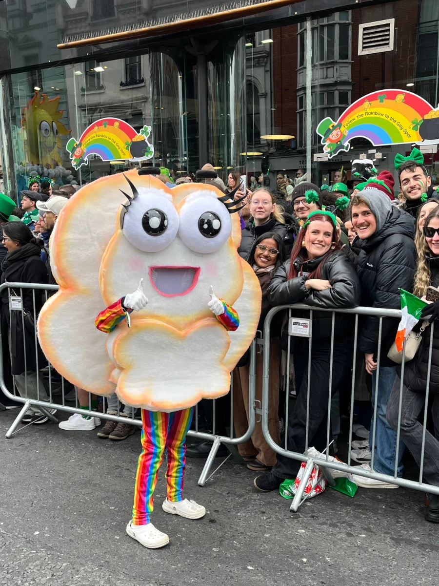 Photo of costumed cloud figure with crowd at St Patricks Day Parade 2025