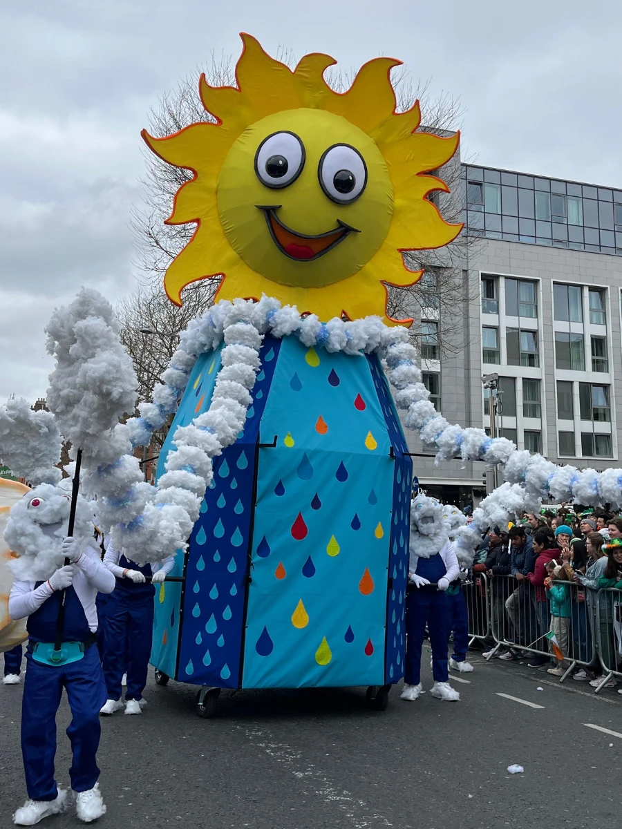 Photo of large float of sun figure at St Patricks Day Parade 2025.