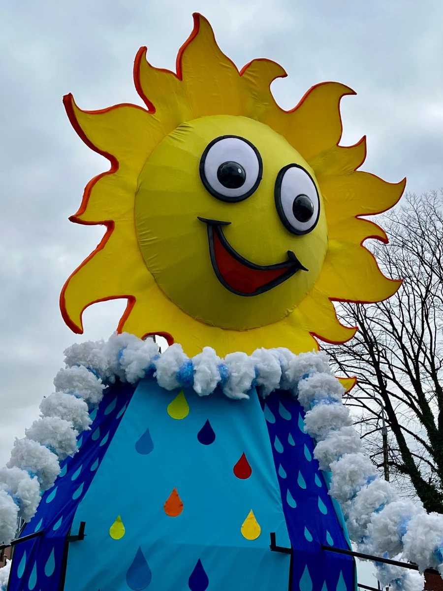 Photo of large float of sun figure at St Patricks Day Parade 2025.