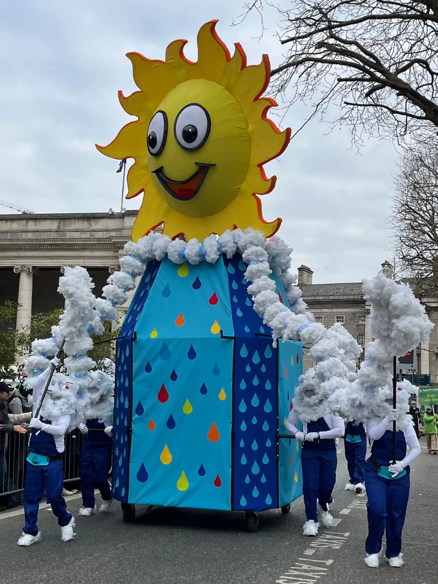 Photo of large float of sun figure at St Patricks Day Parade 2025.