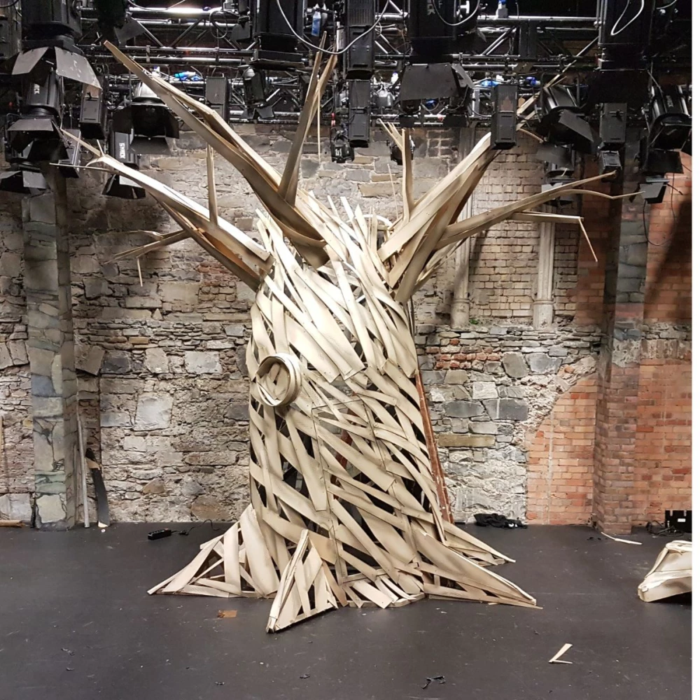 Large-scale sculpture of tree.