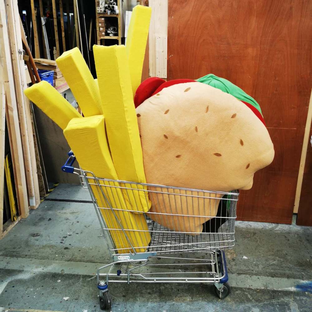 photo of large scale chips and burger in a shopping trolley - specialist prop